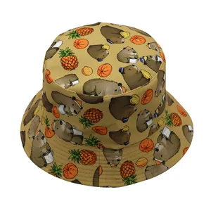 Detail of Capybara and fruit pattern print on beige reversible bucket sun hat