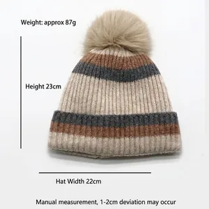 Striped winter knit hat for kids with pompom, 23cm height and 22cm width shown with size info