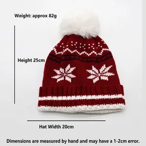 Bonnet en tricot rouge pour enfants avec motifs flocons et pompon blanc pour l'hiver