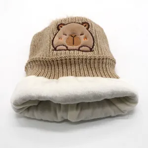 Winter Capybara knitted beanie for children with fleece lining and pom-pom detail