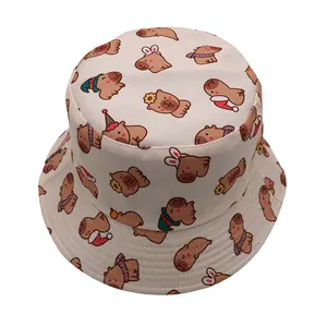 Detail view of beige canvas bucket hat featuring colorful cartoon capybara print patterns