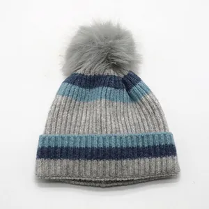 Striped winter knit hat for kids with grey pom-pom and thick fleece lining in blue tones