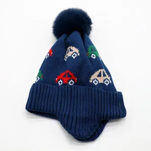Kids navy knit earflap hat with colorful car patterns and a fluffy pom-pom top