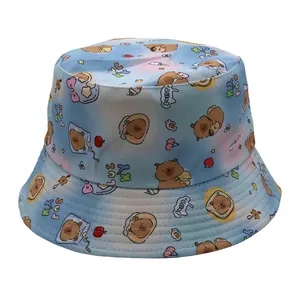 Close-up of cute cartoon Capybara print on a blue gradient reversible bucket sun hat