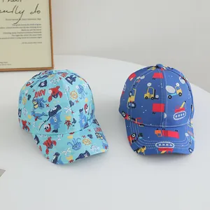 Detail of kids baseball caps featuring pirate and construction vehicle cartoon prints