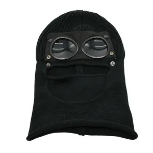 Close-up of black knitted balaclava with integrated goggles for windproof protection