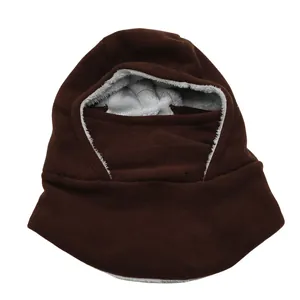 Detailed view of the thick gray faux fur lining inside the brown winter balaclava
