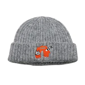 Grey knit beanie with cute cartoon cat embroidery and 'COOL' text for winter warmth