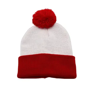 Close-up of the red and white knit pom-pom beanie with high-quality warm yarn texture