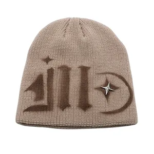 Street style knit beanie in beige with brown graphic print and silver metal star detail