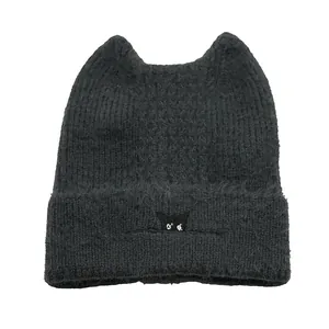 Black knit beanie with cat ears and eye embroidery in fluffy mohair style