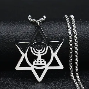 Macro shot of silver stainless steel hexagram and menorah pendant on black leather