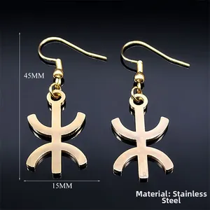 Macro view of gold Amazigh symbol hook earrings with 45mm x 15mm dimensions