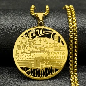 Macro shot of gold stainless steel Jerusalem skyline pendant with Hebrew engraving