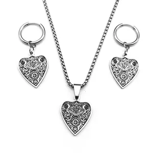 Gothic stainless steel jewelry set with crescent moon heart pendants on white background
