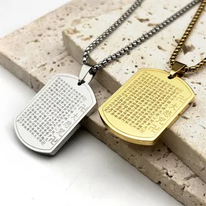 Close-up of gold and silver Buddhist scripture pendants with detailed engraving