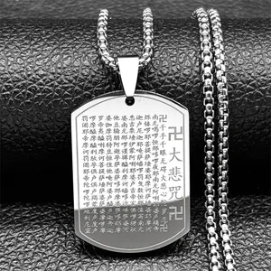 Macro shot of Buddhist scripture engraving on rectangular stainless steel pendant