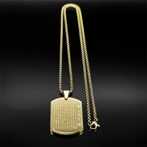 Macro shot of gold stainless steel dog tag pendant with engraved Buddhist scripture