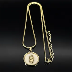 Detailed view of 18k gold plated Virgin Mary pendant with white pearl inlay on black background