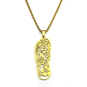 Gold flip-flop pendant necklace featuring tropical monstera leaf and floral cutouts