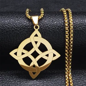 Detailed view of golden Celtic knot pendant on textured black leather surface
