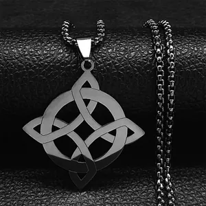 Detailed view of silver Celtic knot pendant necklace on dark leather surface