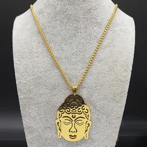 Golden titanium steel Buddha head pendant necklace displayed on a jewelry stand