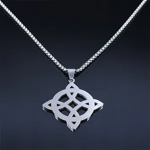 Polished silver stainless steel Celtic knot pendant necklace on a sleek black mirror base