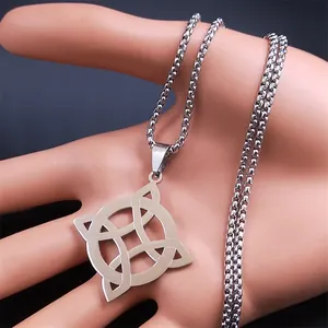 Macro detail of silver stainless steel witch's knot pendant on a box chain