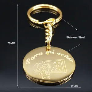 Golden stainless steel teacher keychain with Para mi seño engraving and cartoon motif