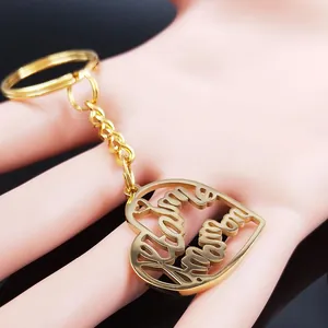 Golden Mother's Day heart keychain with Love Mama cutout design held in hand