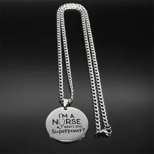 Detailed view of silver nurse necklace with stethoscope icon and superpower engraving