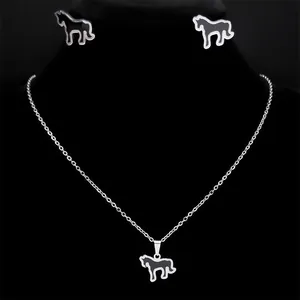 Detail view of silver unicorn jewelry set with black enamel inlay on earrings and necklace