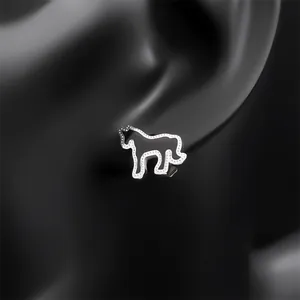 Minimalist silver and black enamel unicorn stud earrings displayed on a black mannequin