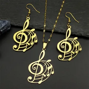 Exquisite gold music note jewelry set featuring treble clef and stave on dark stone
