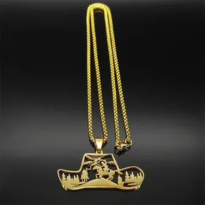 Macro shot of 18K gold hollow cowboy hat pendant with mountain horse scenery details