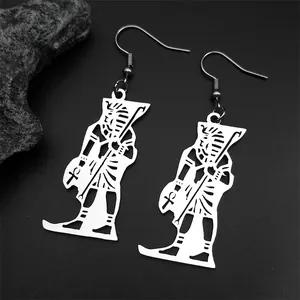 Detail of silver stainless steel Egyptian Pharaoh silhouette dangle earrings with Ankh symbol