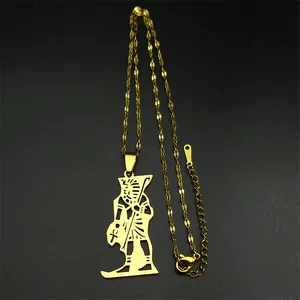 Close-up of golden Egyptian Pharaoh pendant with Ankh symbol and S.STEEL hallmark