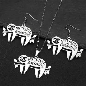 Detail of silver sloth jewelry set featuring engraved 'MY SPIRIT animal' on black stone