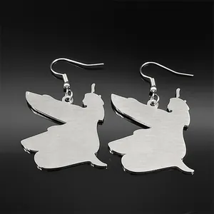 Detail of silver Peter Pan silhouette earrings with brushed stainless steel texture