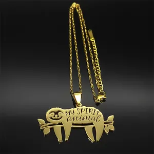 Detailed close-up of golden sloth pendant with My Spirit Animal hollow engraving