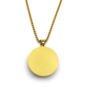 Minimalist gold pendant necklace with matte circular charm and classic box chain