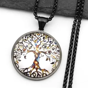 Close-up of black tree of life pendant with colorful art glass and box chain necklace