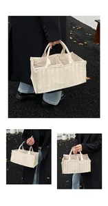 Macro view of quilted cream tote bag showing internal compartments and lining texture