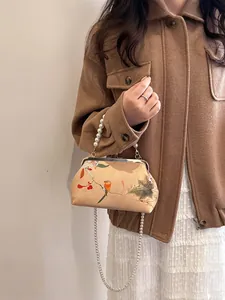 Vintage pearl chain handbag with floral bird print for formal evening parties and events