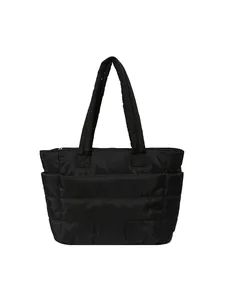 Large black quilted puffer tote bag made of glossy waterproof nylon for gym or travel