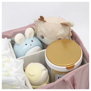 Pink quilted diaper caddy with spacious compartments for diapers and milk powder