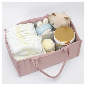 Top view of pink quilted diaper caddy with three compartments for baby nursery storage