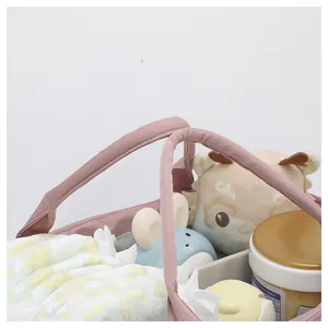 Detailed view of pink felt baby diaper caddy organizer showing internal storage space