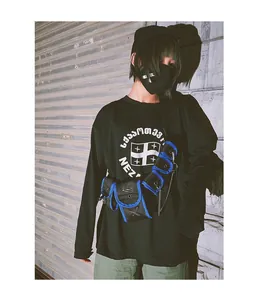 Detail of street style black and blue tactical chest bag with multi-pockets and buckles
